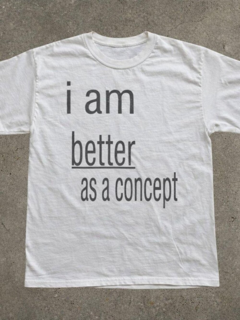 White “I am better as a concept” text tee